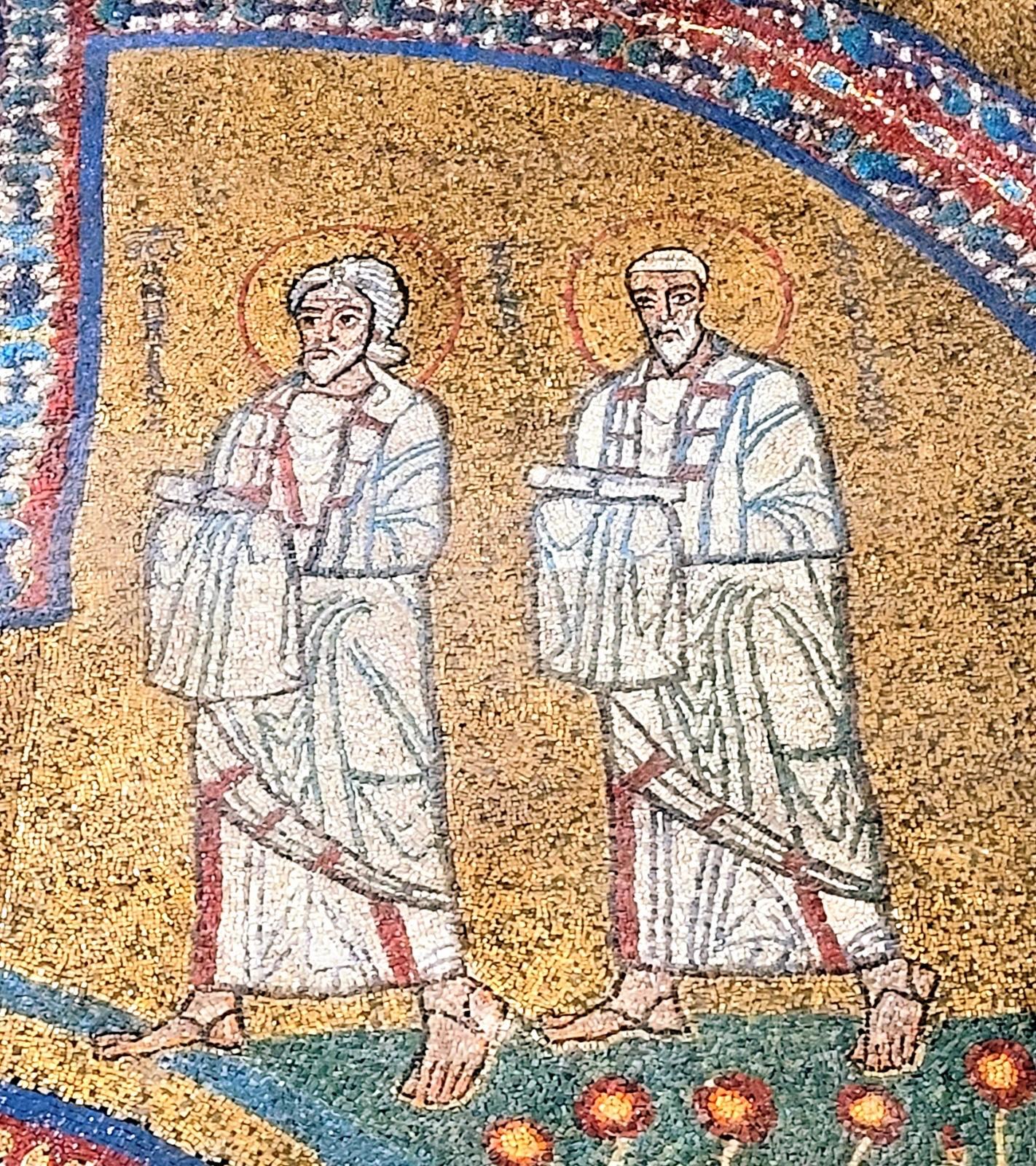 The image shows a detail of the 9th-century mosaics in the Chapel of Saint Zenon within the Basilica of Saint Praxedes in Rome, probably depicting figures of apostles or saints in white robes against a gold background